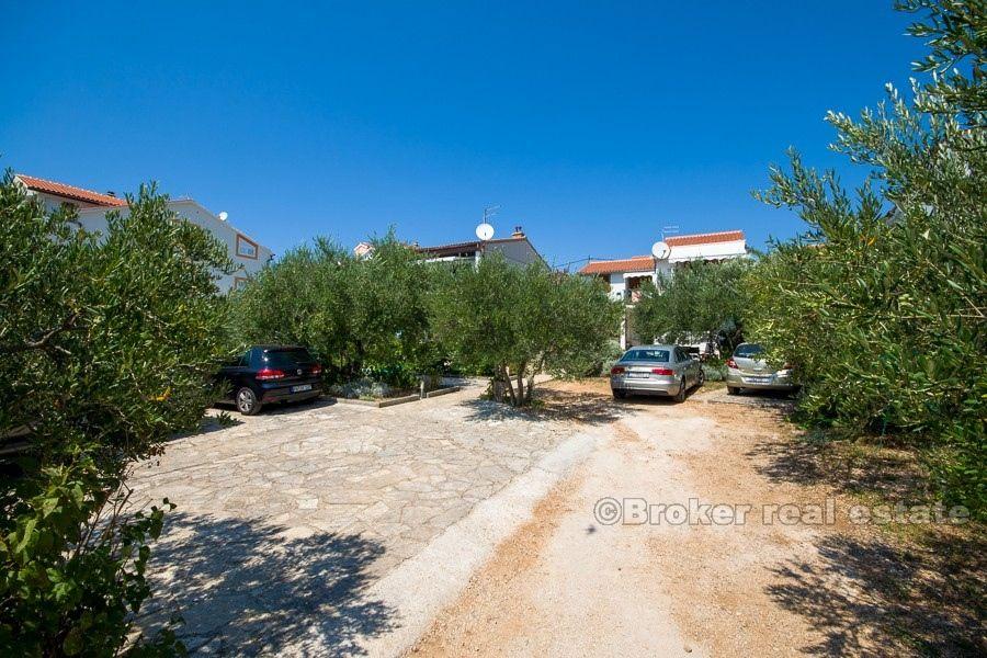 Two houses on a larger plot, by the sea, for sale.