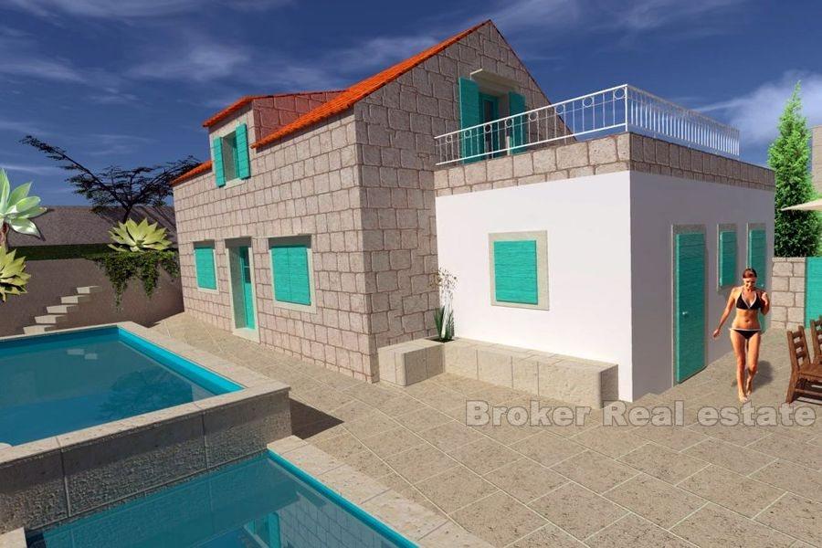 Byggeplot med steinhus for gjenoppbygging