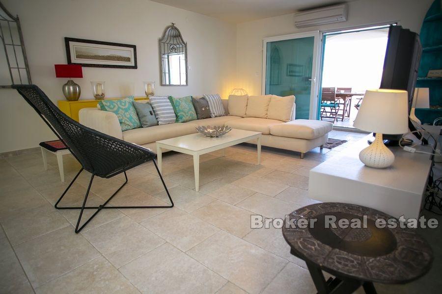 Modernly designed villa, first row to the sea