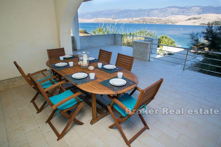Modernly designed villa, first row to the sea
