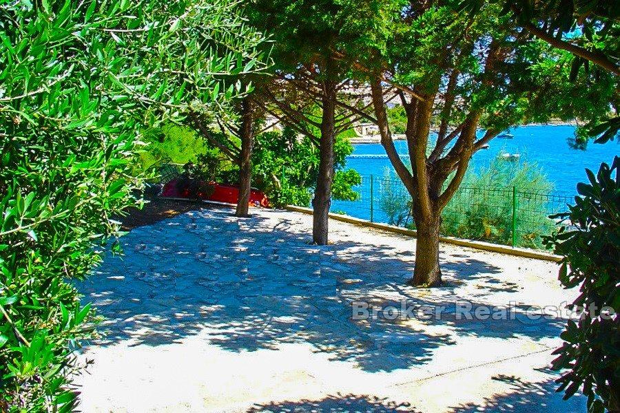 House, first row to the sea, by the beach.