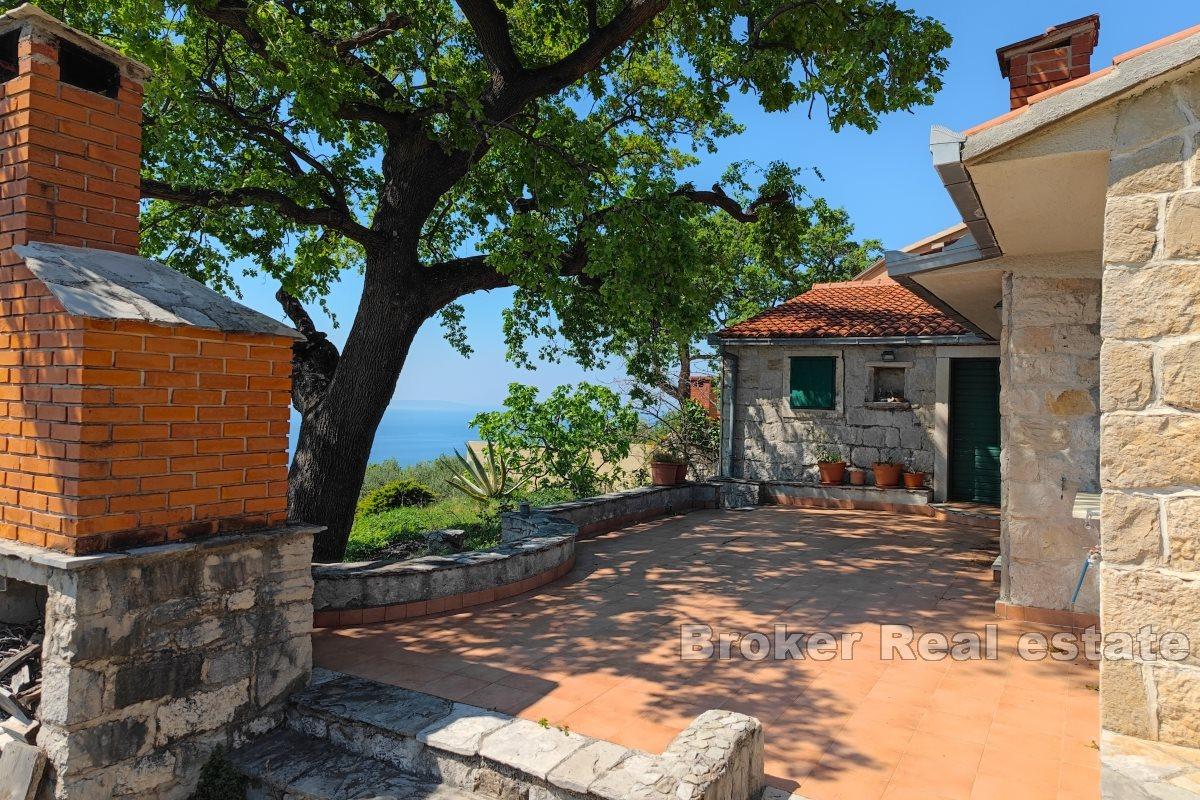 A house in nature with a panoramic view of the sea
