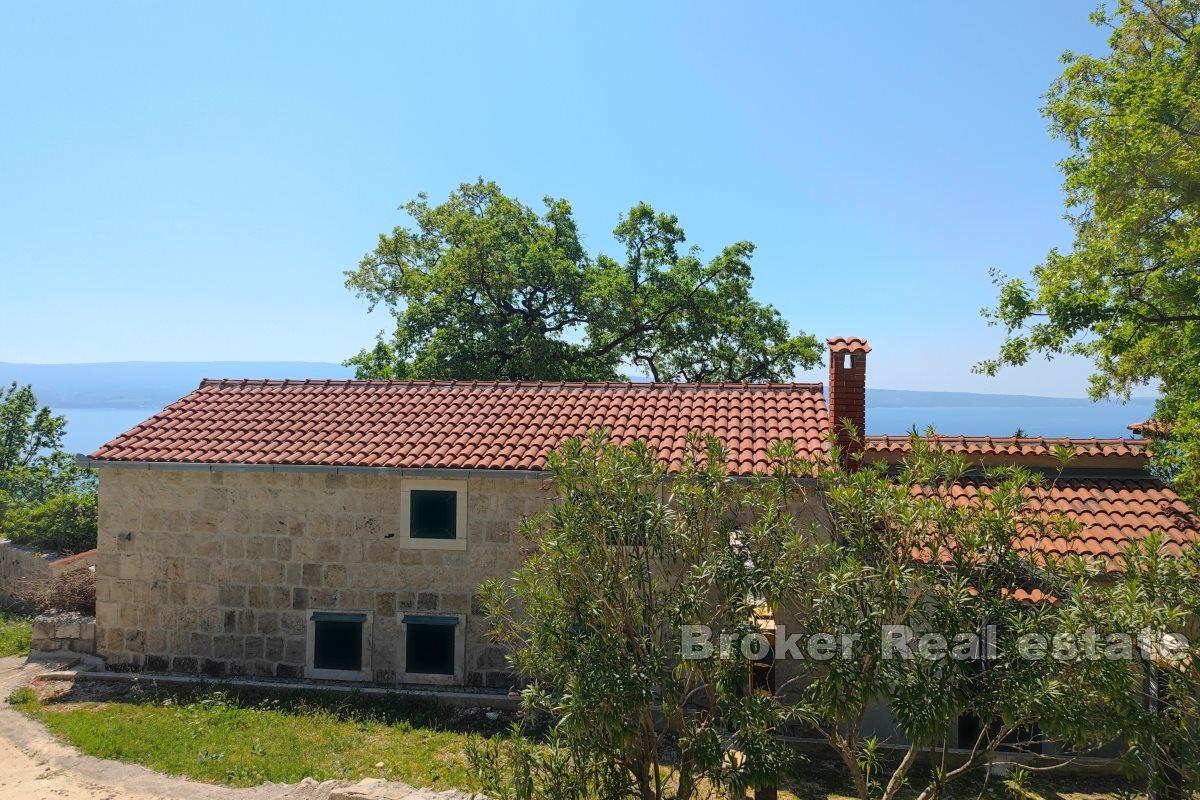 A house in nature with a panoramic view of the sea