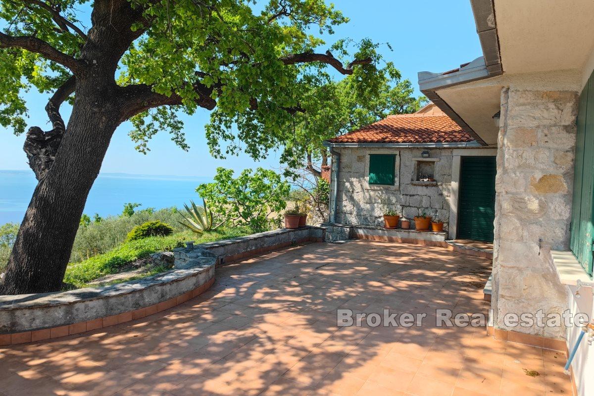 A house in nature with a panoramic view of the sea