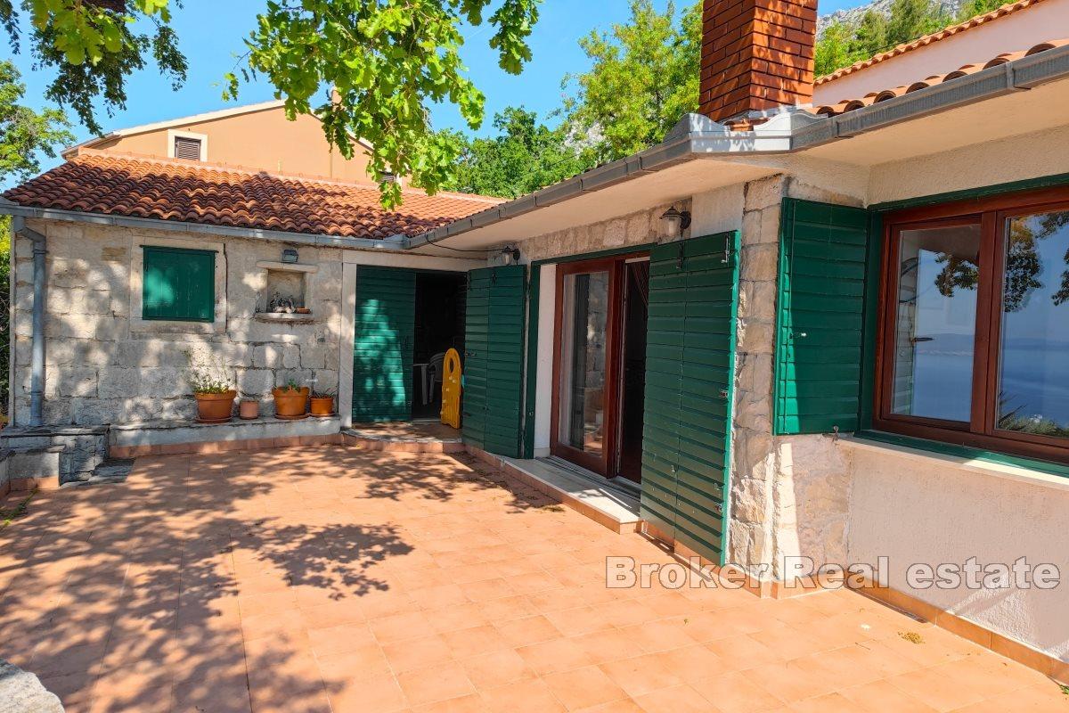 A house in nature with a panoramic view of the sea