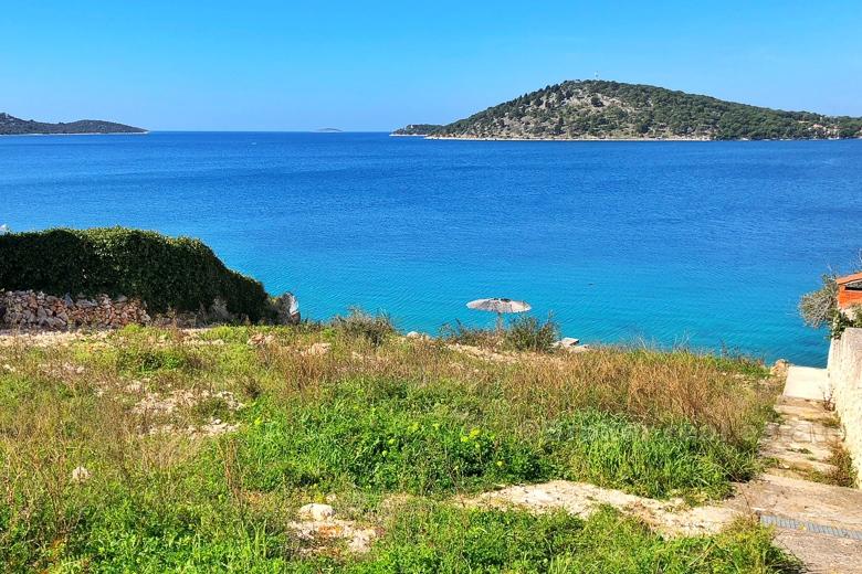 Exceptional building land plot at first row to the sea.