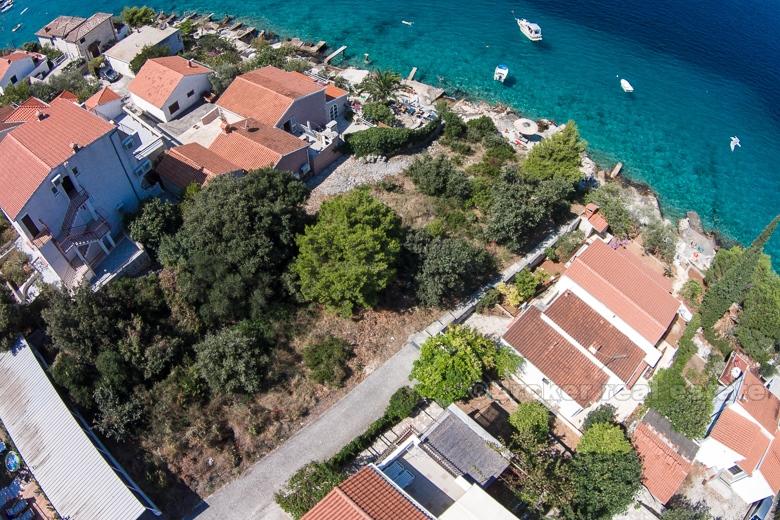 Exceptional building land plot at first row to the sea.