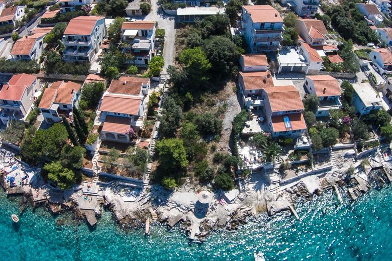 Exceptional building land plot at first row to the sea.