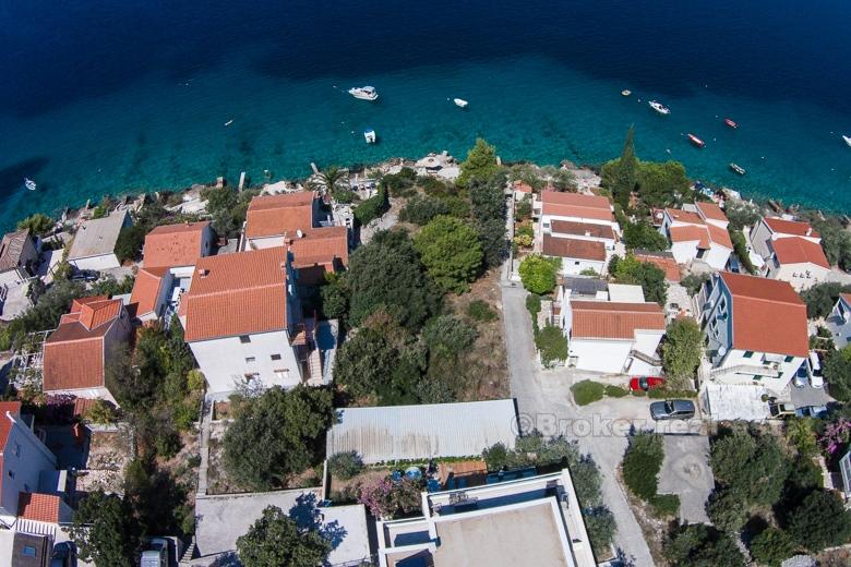 Exceptional building land plot at first row to the sea.