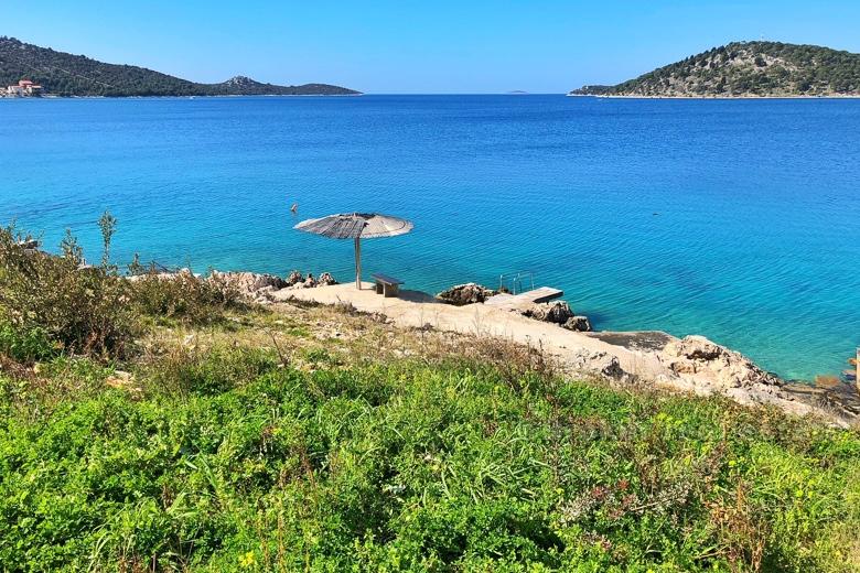 Exceptional building land plot at first row to the sea.