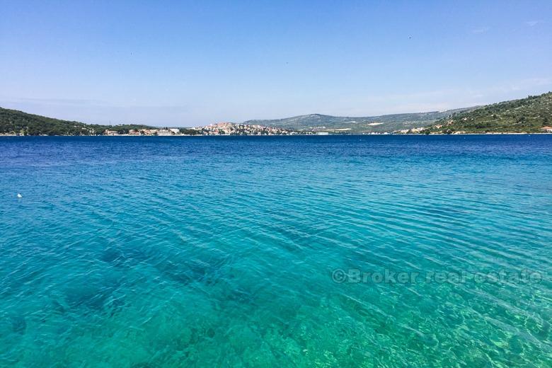 Exceptional building land plot at first row to the sea.
