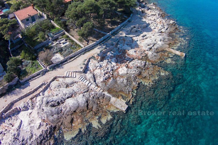 House at amazing location first row to the sea