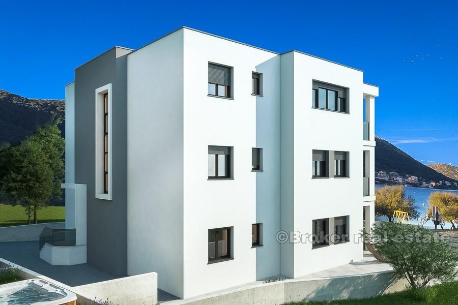 New modern apartments in the first and second row to the sea