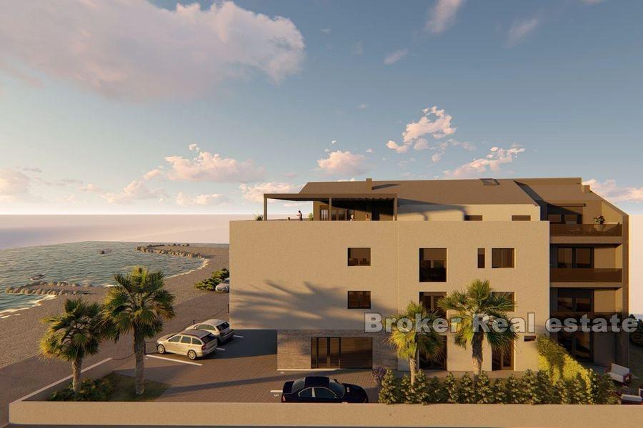 Two and three bedrooms apartments in the first row to the sea