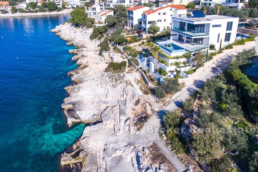 Modern villa with a pool by the sea