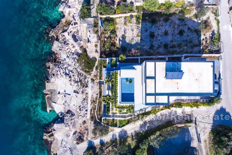 Modern villa with a pool by the sea