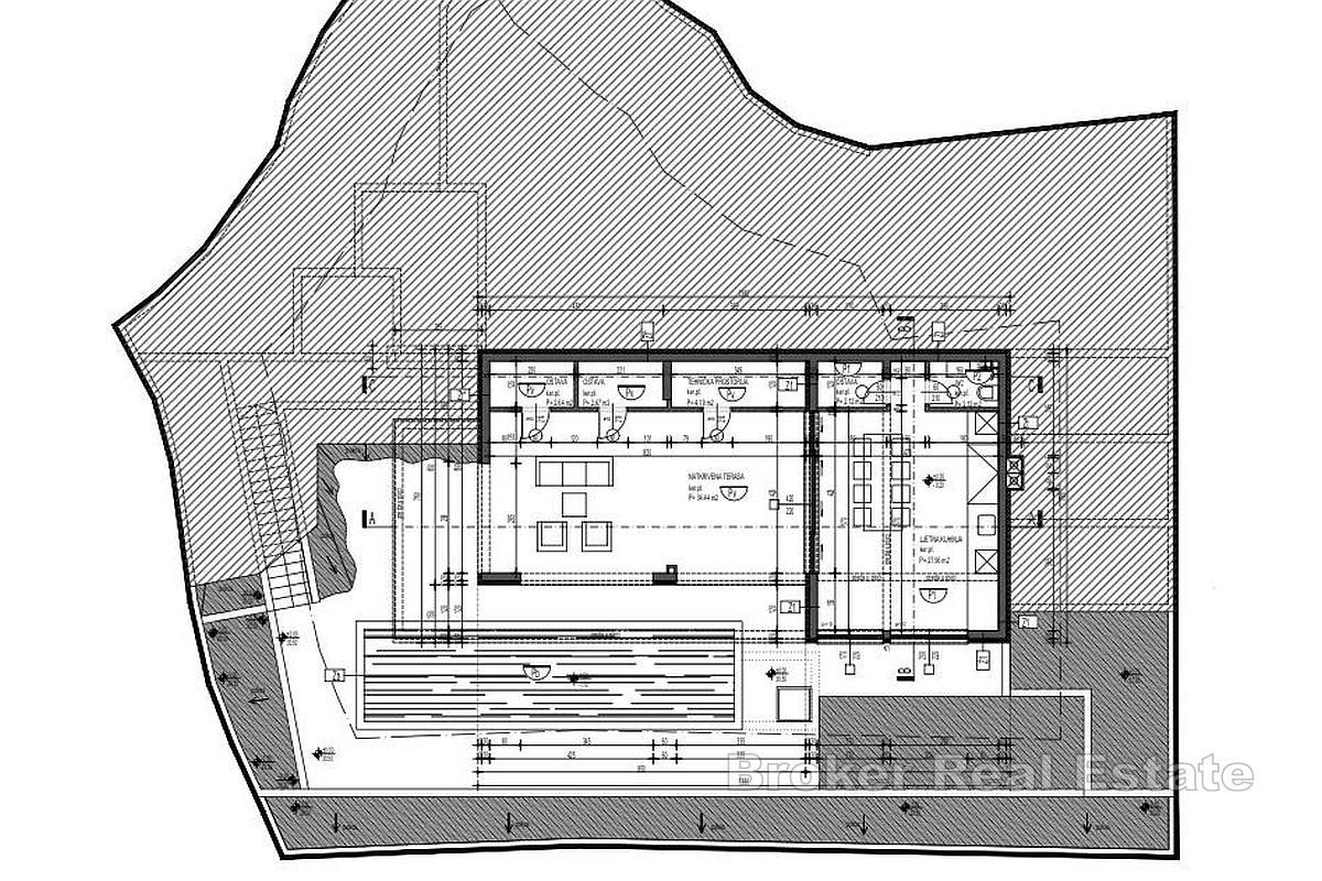 Byggtomt med projekt och panoramautsikt över havet