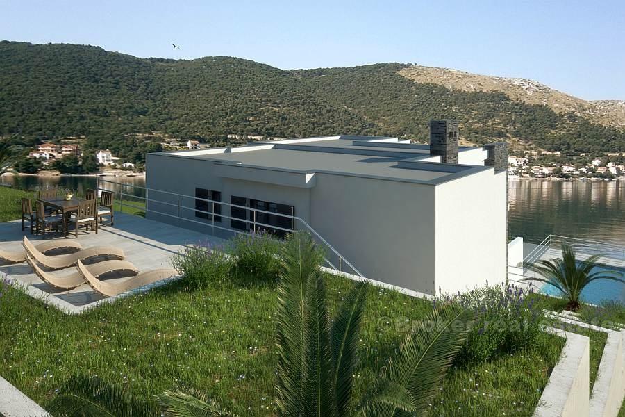 Новая вилла в первом ряду от моря