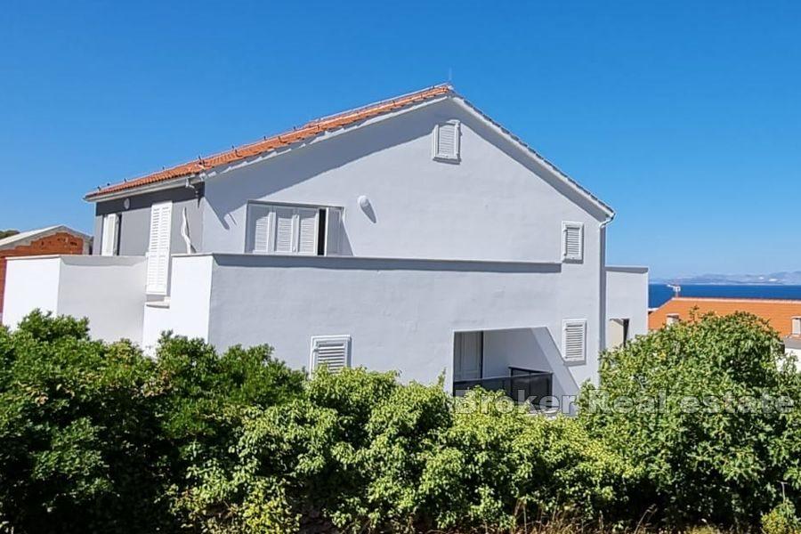 Nová menší obytná budova se 7 byty