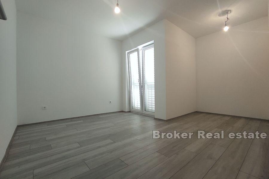 Nová menší obytná budova se 7 byty