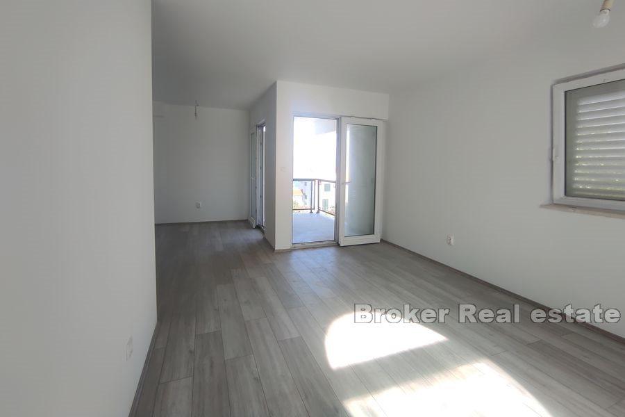 Nová menší obytná budova se 7 byty