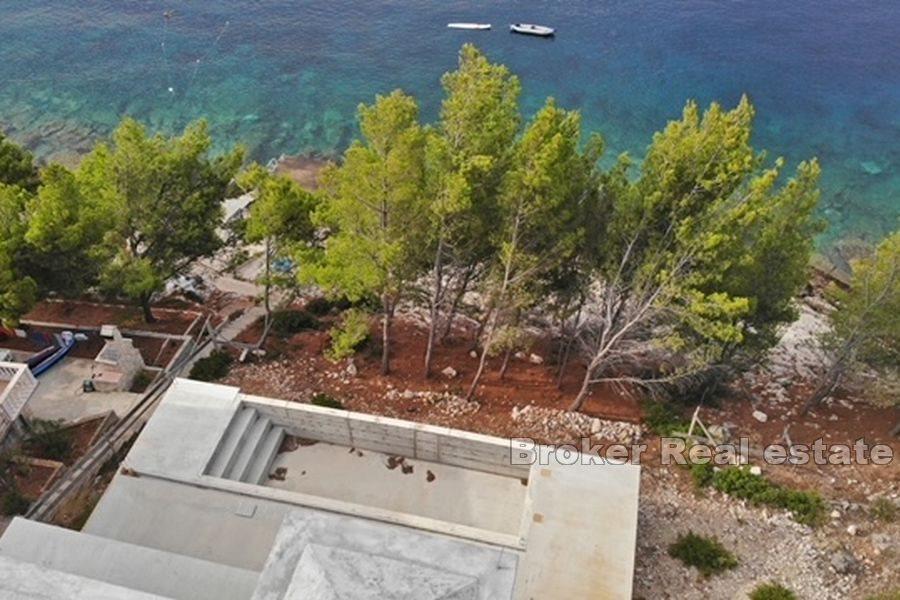 Unfinished house with pool, first row to the sea