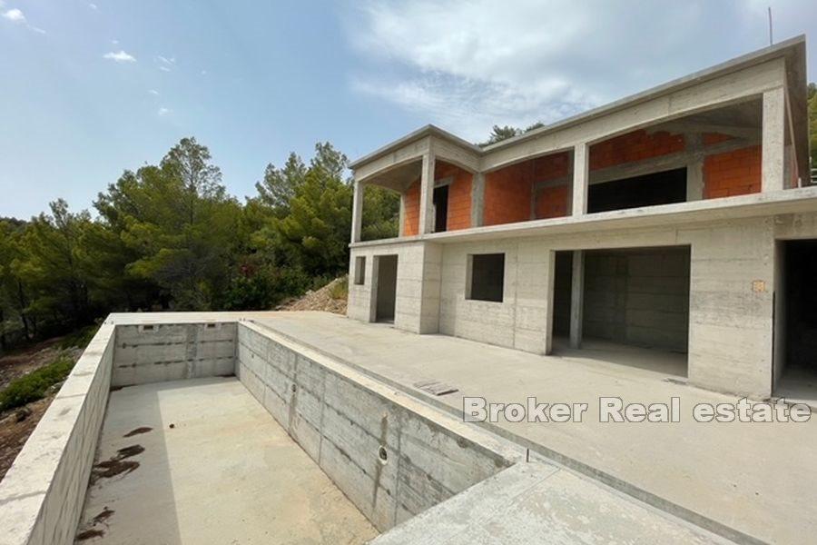 Unfinished house with pool, first row to the sea