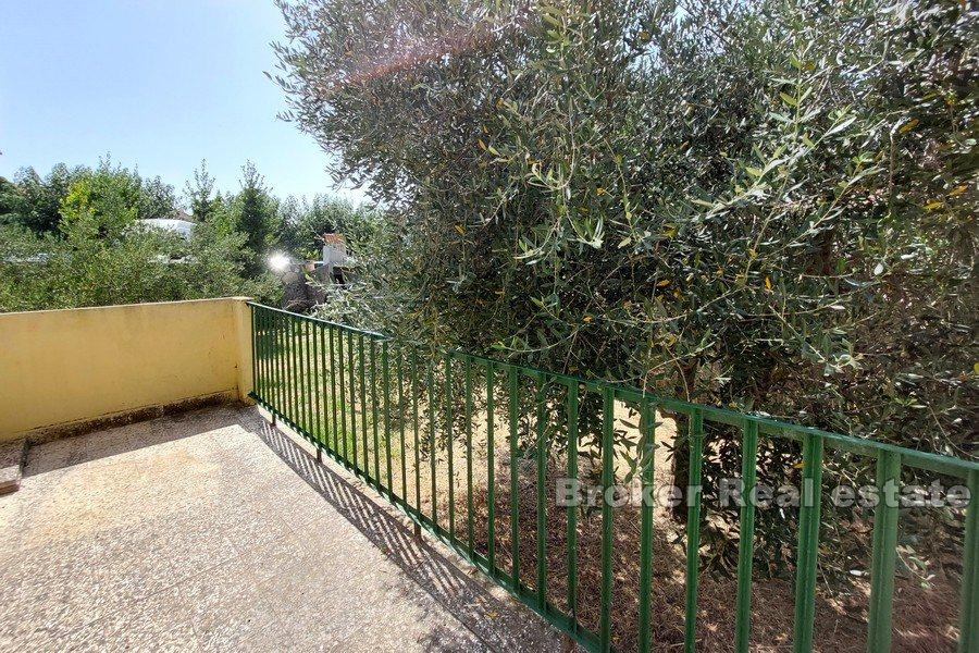 House near the sea and the city center