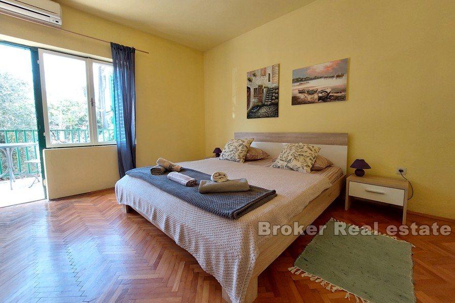 House near the sea and the city center