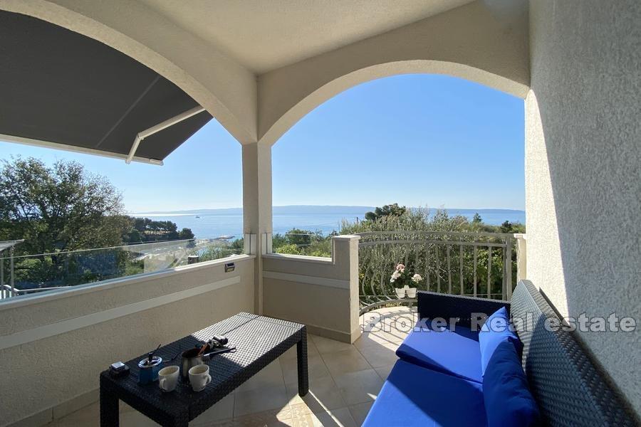 House with a pool and sea view