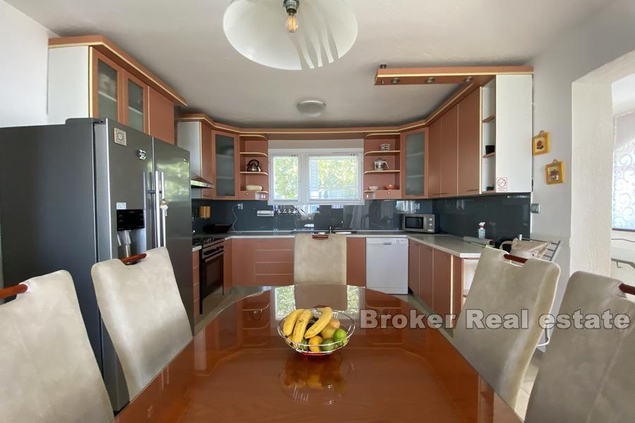 House with a pool and sea view