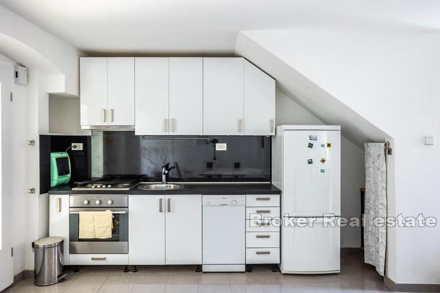 Stone house in the center with a courtyard