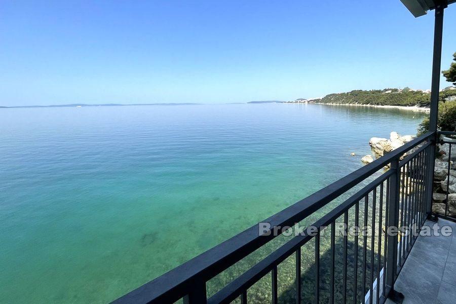 House first row by the sea