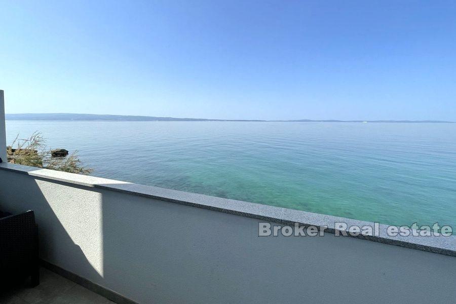 House first row by the sea