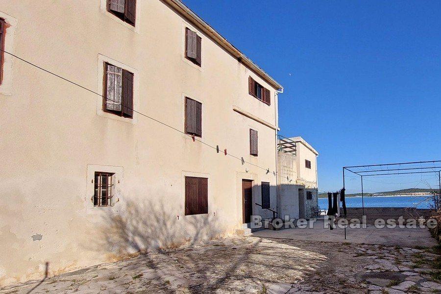 House for renovation, first row to the sea