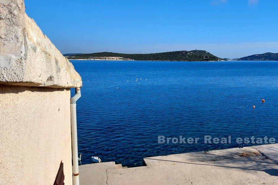 House for renovation, first row to the sea