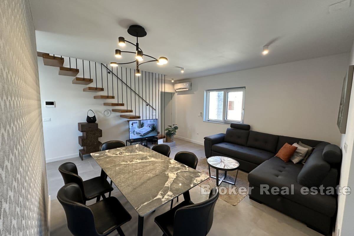 Duplex apartment with a roof terrace in a new building