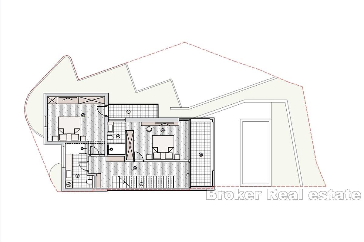 Nově postavený dům v řadě s otevřeným výhledem na moře