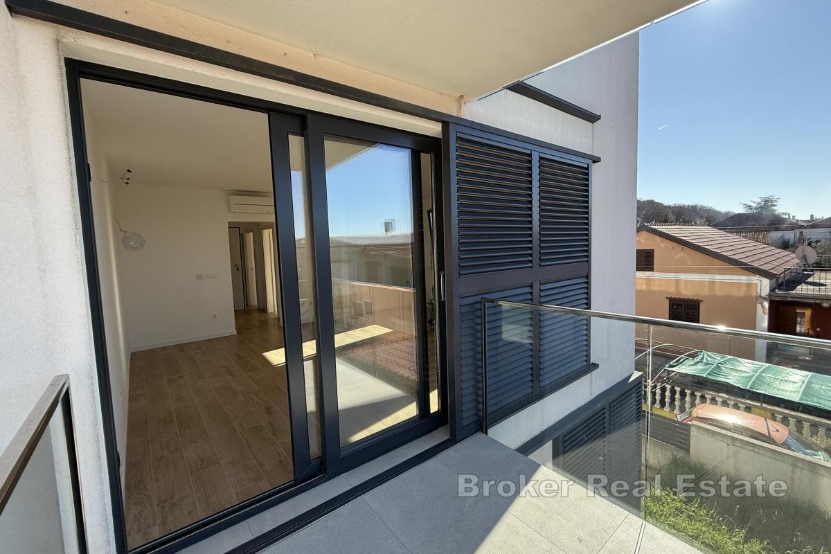 Appartement moderne de deux chambres avec parking