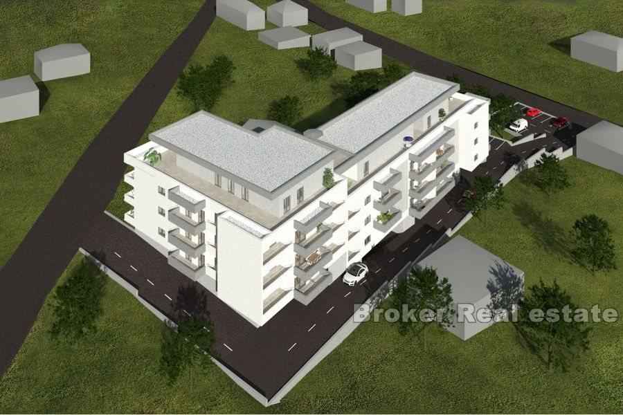 Appartements dans un immeuble neuf avec vue mer