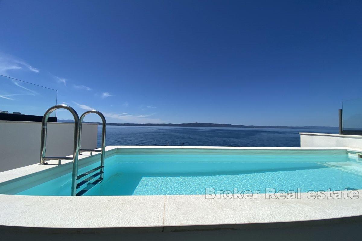 Attractive villa with roof pool, first row to the sea