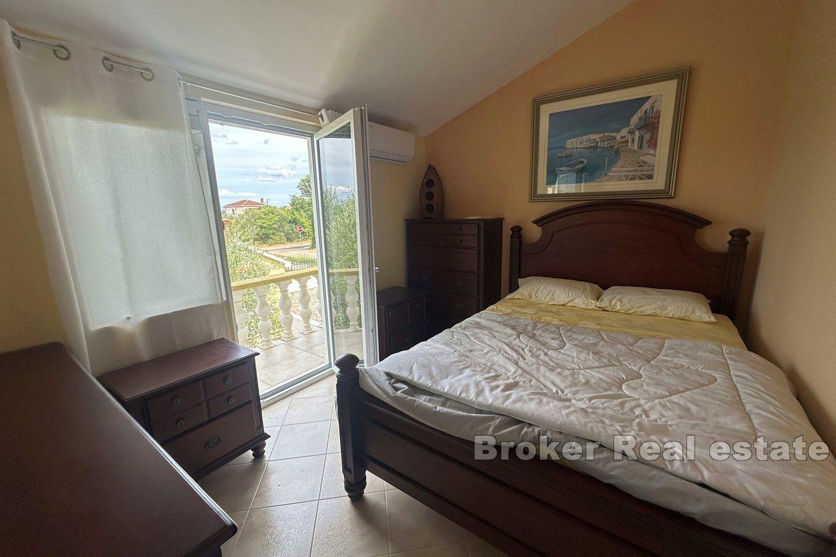 Two detached houses with a large garden