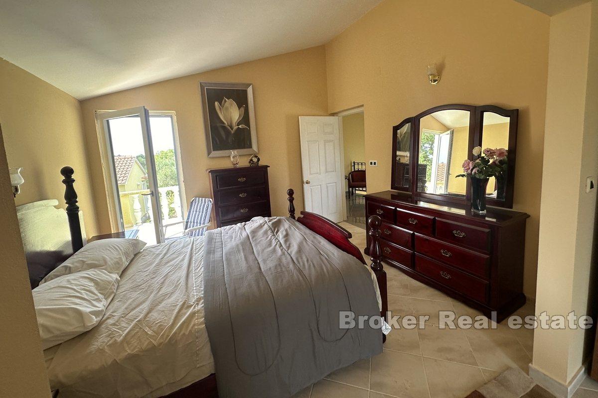 Two detached houses with a large garden