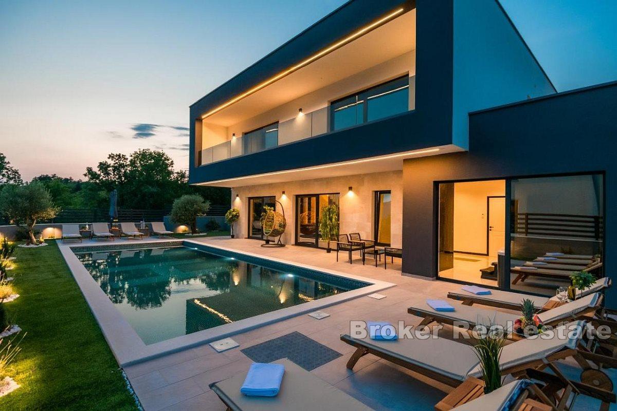 Modern luxury villa with pool in a beautiful natural environment