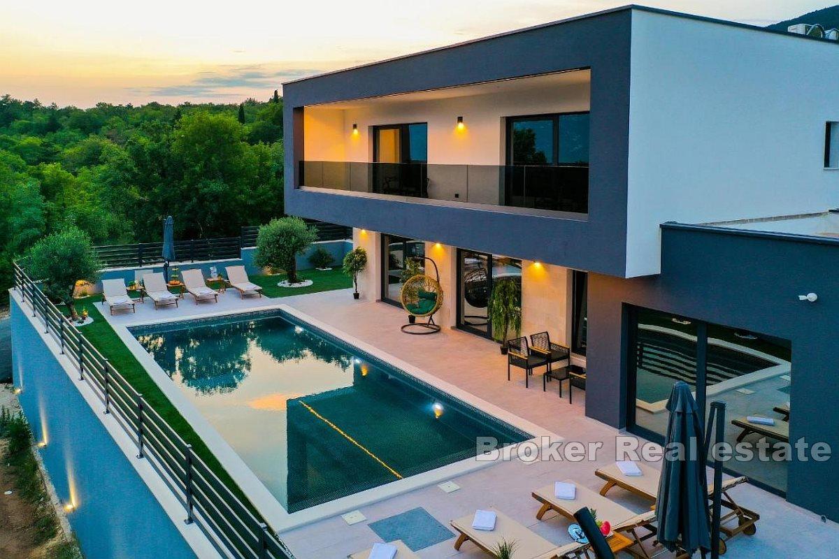 Modern luxury villa with pool in a beautiful natural environment