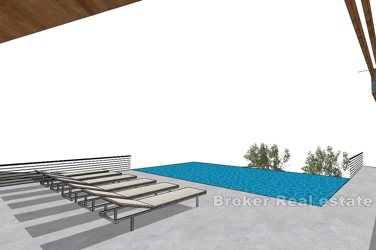 Byggetomt med konseptuell design og havutsikt