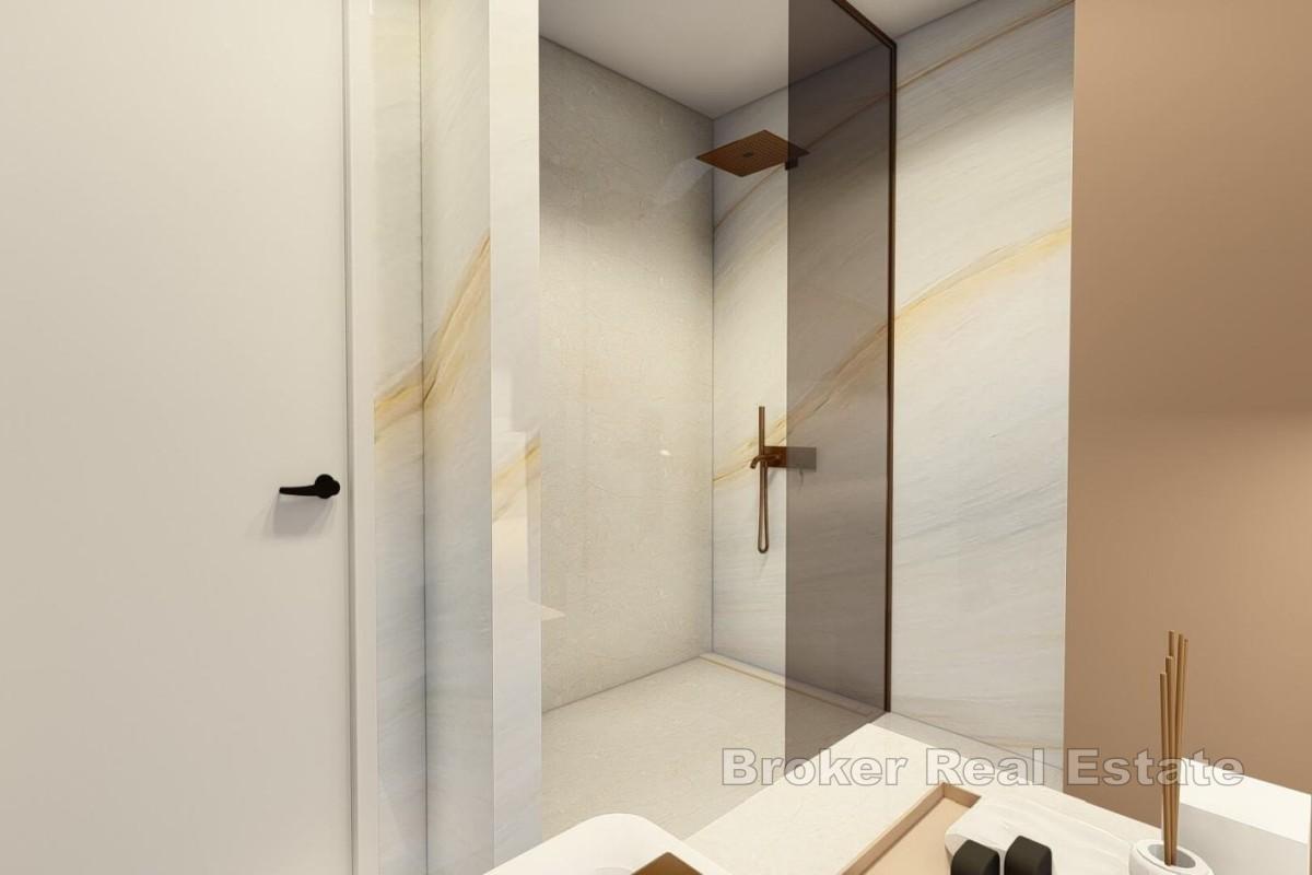 Atraktivan dvosoban apartman u novogradnji s djelomičnim pogledom na more