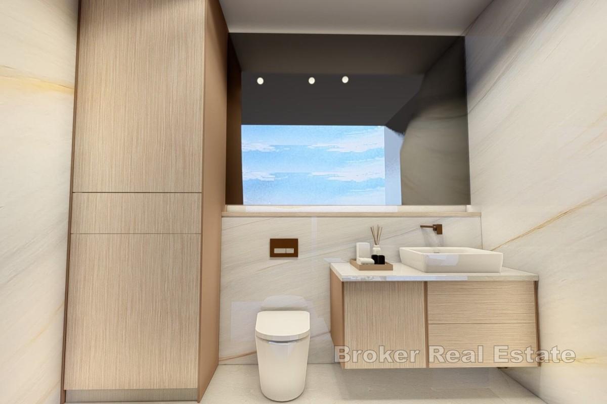 Atraktivan dvosoban apartman u novogradnji s djelomičnim pogledom na more