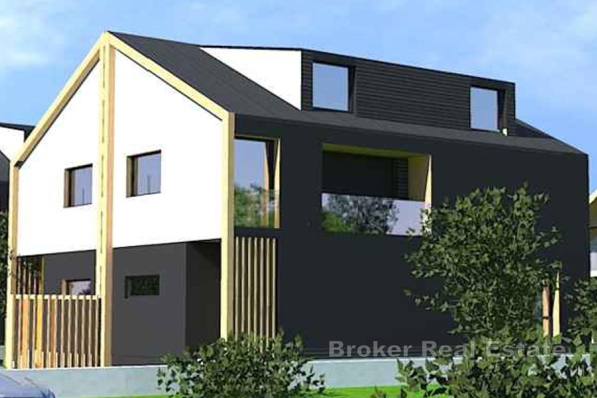 Novostavba - dvojdomek se zahradou o rozloze 150 m2 a dvěma parkovacími místy
