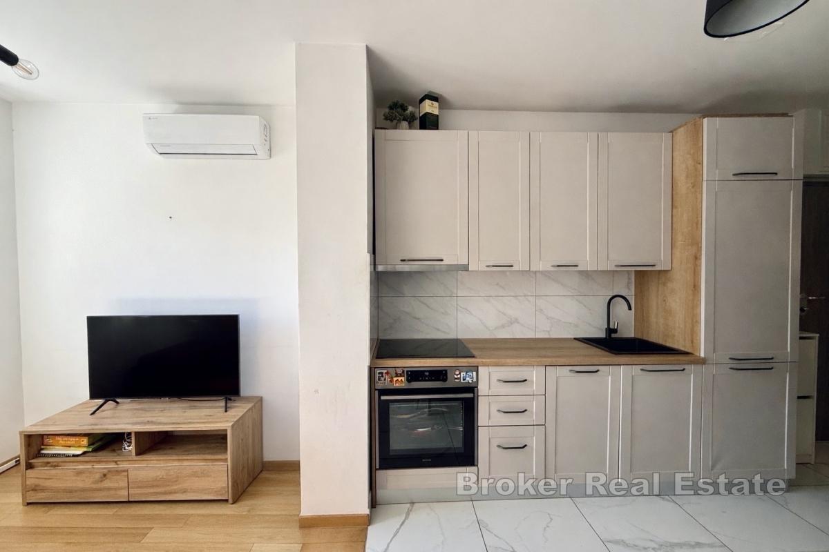 Funksjonell og solrik toromsleilighet med to parkeringsplasser